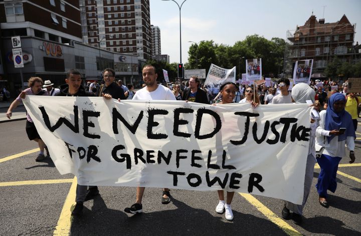 Demonstrators march during a protest about the Grenfell Tower fire, in London