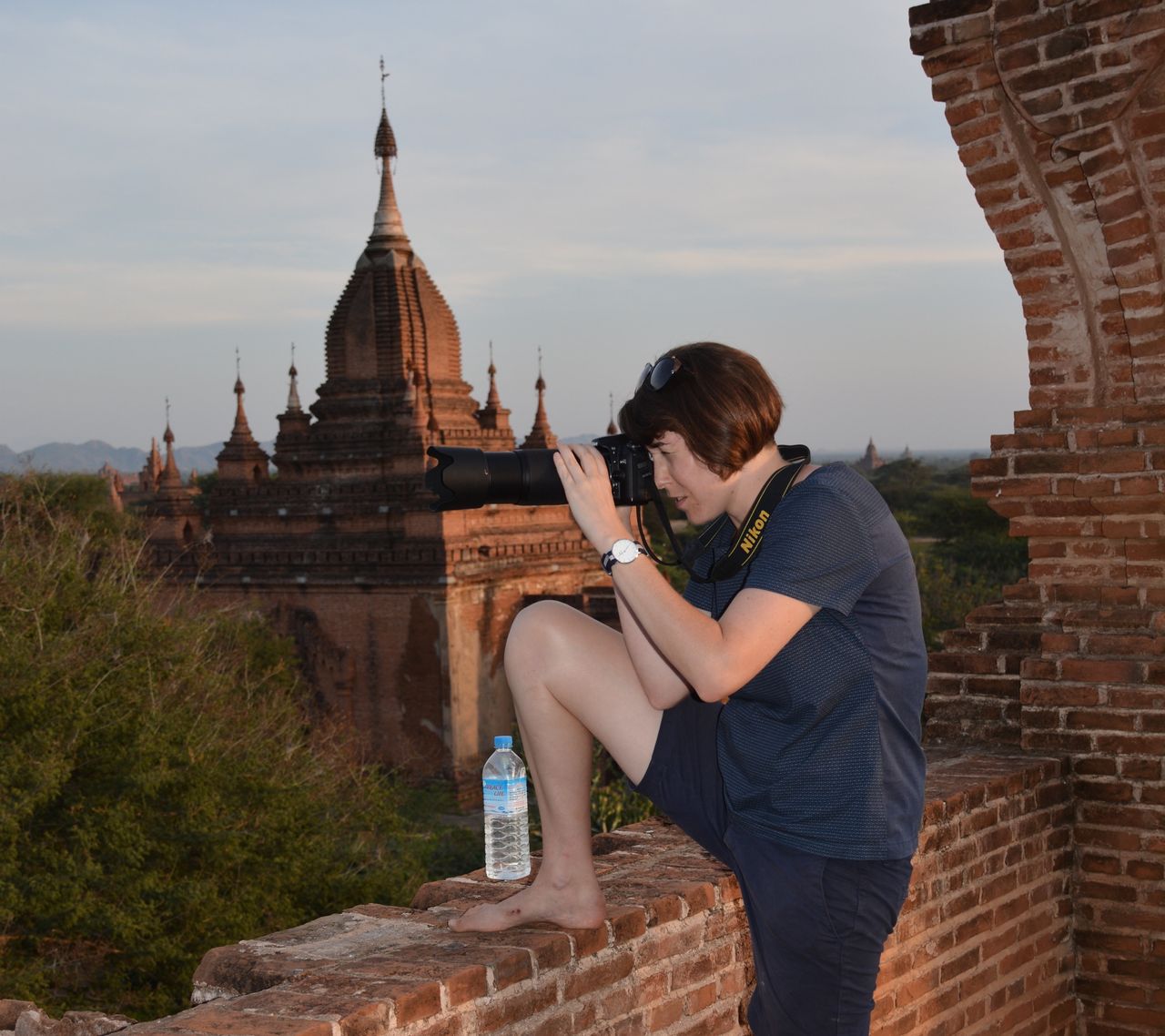 Harrison taking pictures in Bagan as inspiration for her etchings.