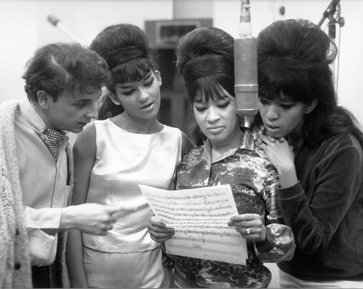 Phil Spector looked at sheet music with hit trio The Ronettes at Gold Star Studios in 1963.