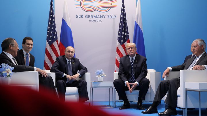 Russian President Vladimir Putin, third from left, sits next to President Donald Trump at a G20 summit meeting in Germany on July 7. An ABC News/Washington Post poll found that 66 percent of Americans are mistrustful of Trump negotiating with Putin.