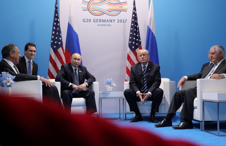 Russian President Vladimir Putin, third from left, sits next to President Donald Trump at a G20 summit meeting in Germany on July 7. An ABC News/Washington Post poll found that 66 percent of Americans are mistrustful of Trump negotiating with Putin.