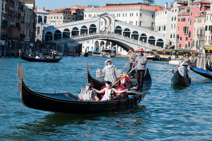 Sylva Dean and Me (and gondolier) near the Rialto Bridge on the Grand Canal in Venice