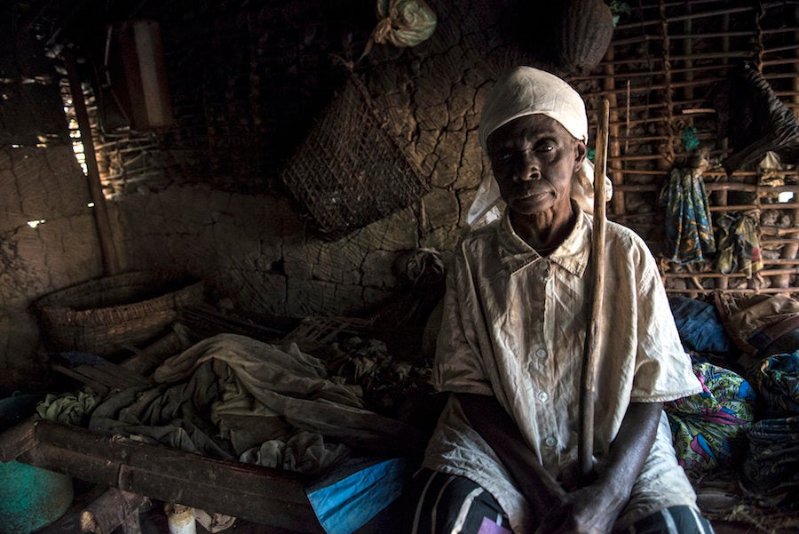 Jetou Mapuani sits in her tiny, one-person hut.