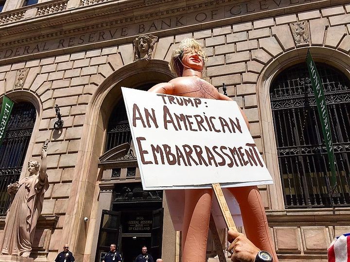 <p>A protest sign outside the Federal Reserve Bank during the Republican National Convention in Cleveland, Ohio, in July 2016.</p>