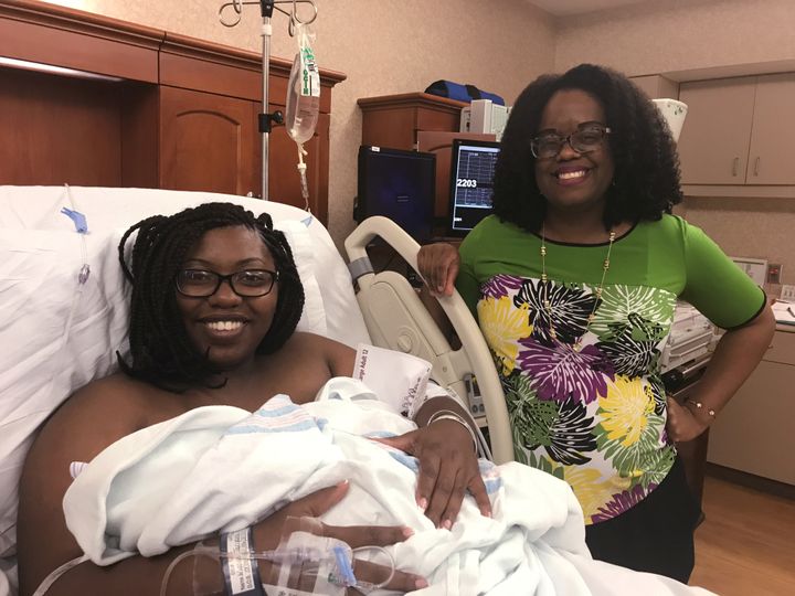 Dr. Nicole Arthur, right, visits Tariyana Wiggins shortly after the birth of Troy O’Brien Williams in the hospital room at the North Baldwin Infirmary, a 70-bed hospital in rural Bay Minette, Alabama. Due to scaled back services, Dr. Arthur performs more Cesarean deliveries, despite the risks and increased recovery time.