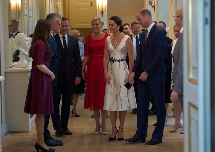 Prince William, Duke of Cambridge, Catherine, Duchess of Cambridge and Poland's First Lady Agata Kornhauser-Duda attend the Queen's Birthday Garden Party at the Orangery, Lazienki Park on day 1 of their official visit to Poland on July 17, 2017 in Warsaw, Poland.