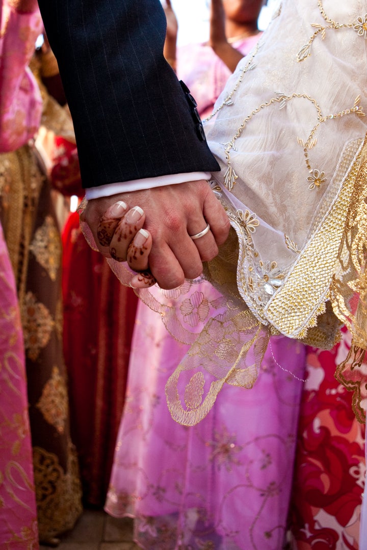 The author decided to act when she realised many Muslim women were lacking practical advice on how to enjoy their married sex lives (file picture of a couple getting married in Morocco) 