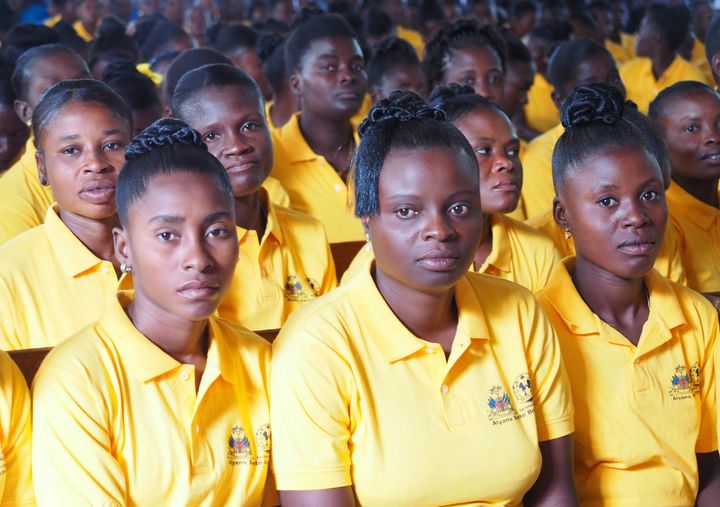 Young women gather in Haiti.