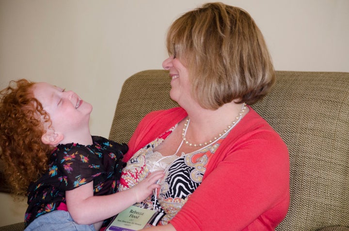 <p>Becky plays with her granddaughter</p>