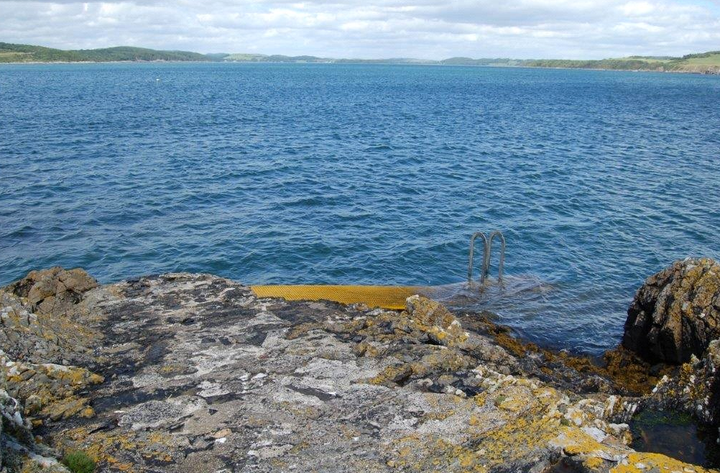 The island is located just off Meikle Ross headland on the mainland 