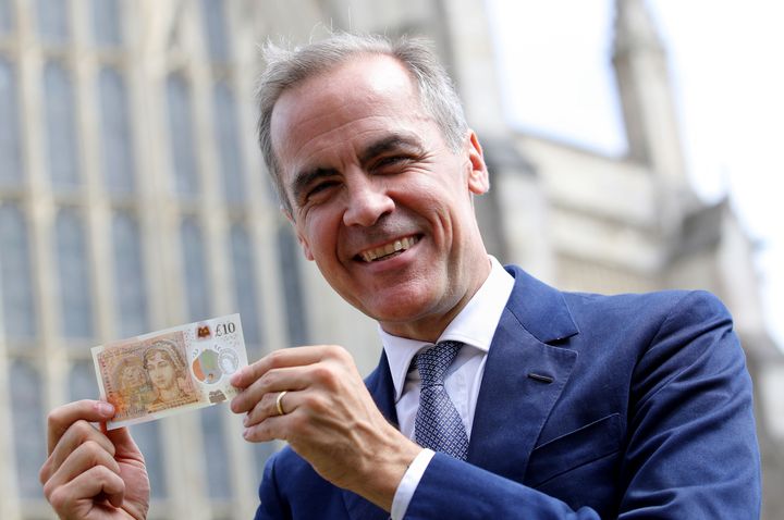 Bank of England Governor Mark Carney holds the new note, unveiled at Winchester Cathedral, Jane Austen's resting place on the 200th anniversary of her death