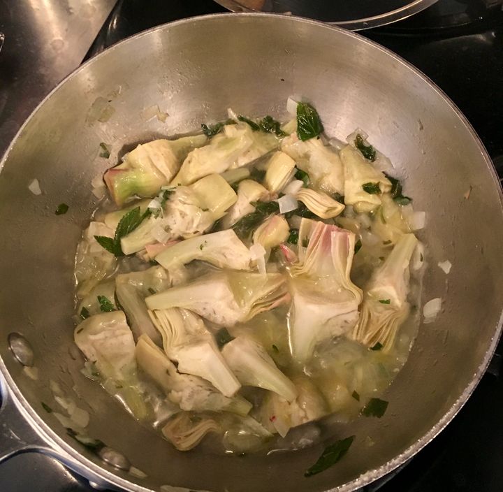 Add a little water (not wine for this dish), cover the pan and smother the artichokes until tender, 7 or 8 minutes probably
