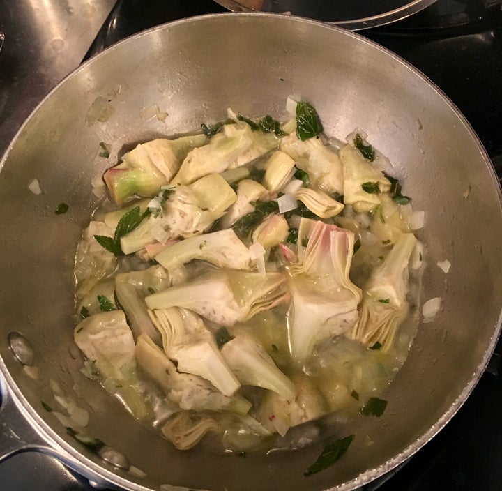 <p>Add a little water (not wine for this dish), cover the pan and smother the artichokes until tender, 7 or 8 minutes probably</p>