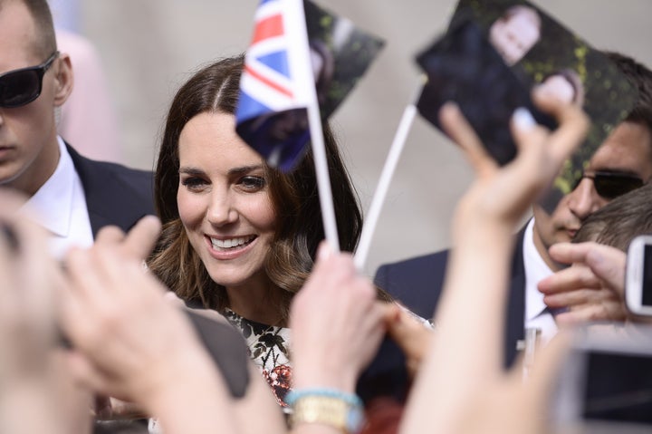 The Duke of Cambridge, Prince William and The Duchess of Cambridge, Catherine Middleton, gather with people at the town market square during their visit to Poland, on July 18 in Gdansk. 