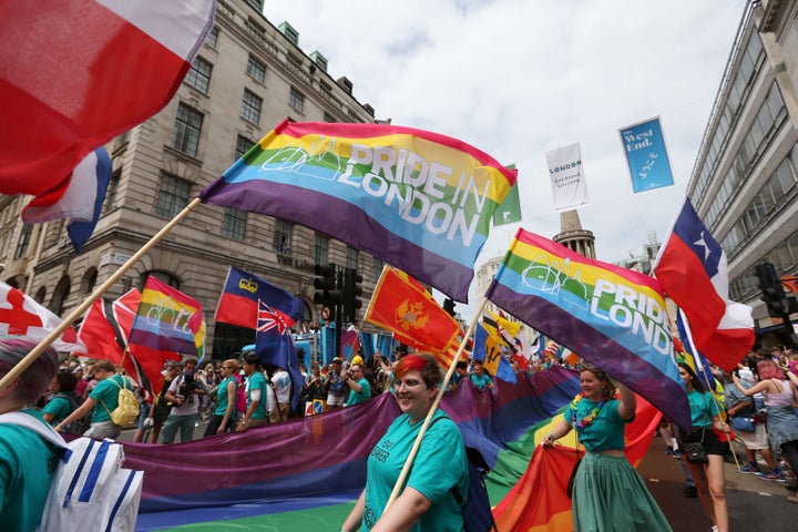 People take part in the Pride in London Parade in central London