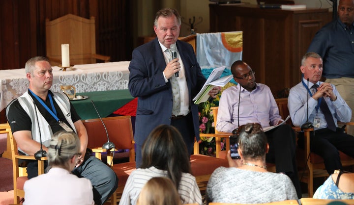 Barry Quirk (centre) speaks during a public meeting between Grenfell residents and authorities at the Notting Hill Methodist Church, London. 