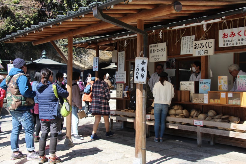 The Shrine’s HQ for baskets, candles, incense, and charms is in the center of the grotto.