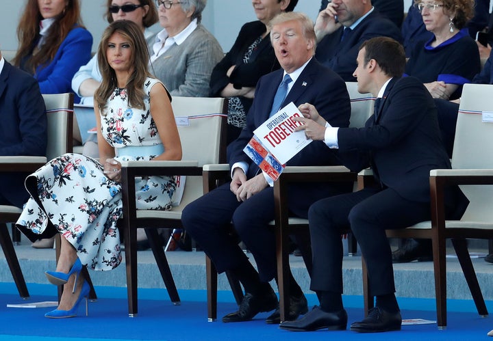 <p> President Macron, President Trump and First Lady Trump attend the 2017 Bastille Day military parade. </p>