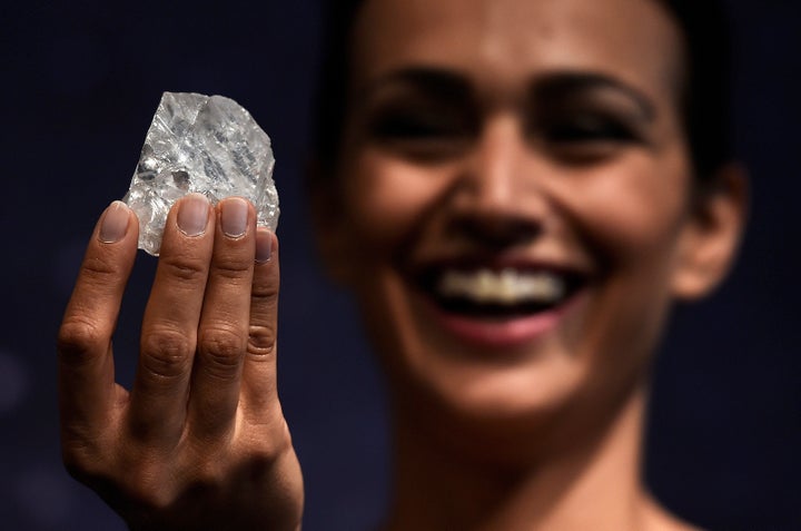 A model shows off the 1109 carat "Lesedi La Rona", the largest gem quality rough diamond discovered in over 100 years during a sale preview at Sotheby's auction house in London, Britain, June 14, 2016