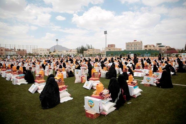 Women collect aid in Sanaa, Yemen, last month.