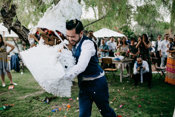 The groom ended up tackling the piñata to get all the goodies out. 