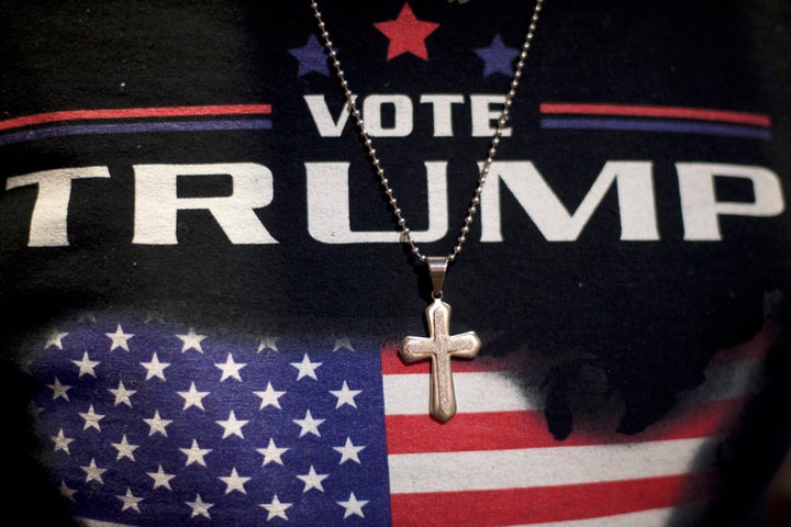 A Christian minister wears a Donald J. Trump-themed shirt with a cross necklace before a 2016 campaign event in Gettysburg, Pennsylvania.