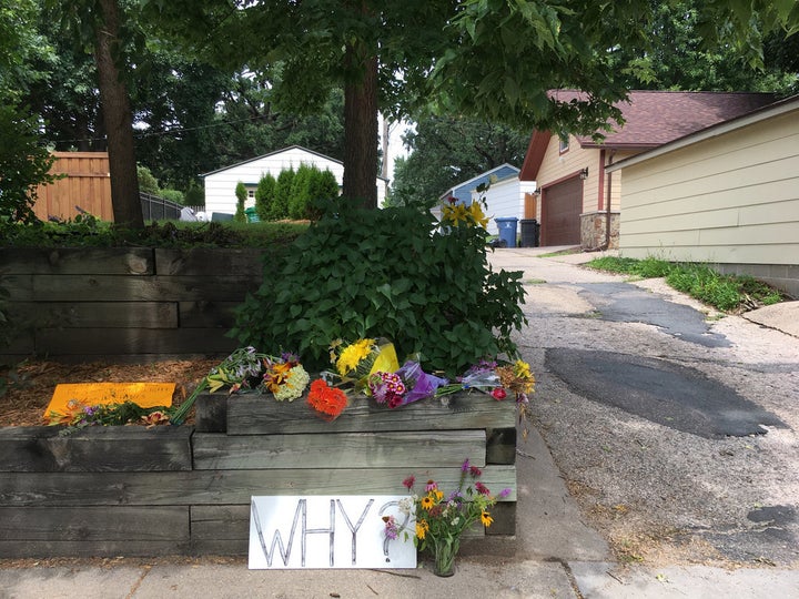 On Wednesday, flowers and a sign that reads,