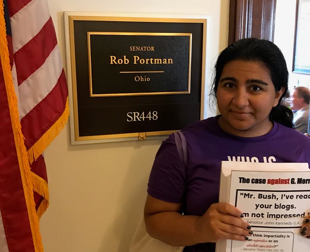 A&nbsp;NARAL volunteer delivers copies of John Bush's blog posts to Sen. Rob Portman's