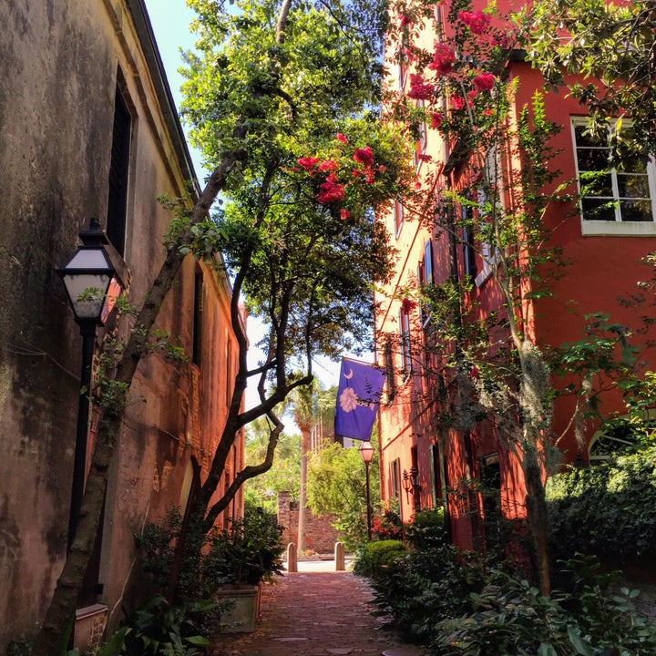 The best way to explore Charleston is to wander down the backstreets and alleys, poke your head into gardens, and stroll through the many graveyards. You can’t get too lost — there’s water on all sides. The flag flying here was a revolutionary war flag, honoring the Palmetto palm tree that played such an important role in the 1776 battle. 