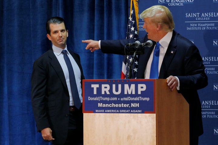 Then-presidential candidate Donald Trump welcomes his son, Donald Trump Jr., to the stage at one of the New England Council's "Politics and Eggs" breakfasts in Manchester, N.H., in November 2015.