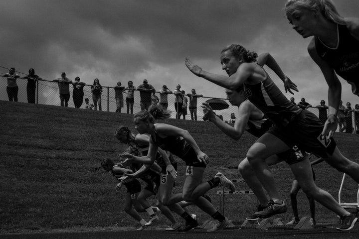 State authorities say the families living in and around Radford face exponentially greater health risks than residents in much of the rest of Virginia. Above, girls start in the 110-meter hurdles as track teams compete at Radford High School.