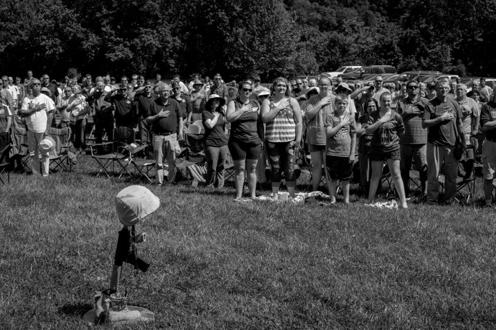 Residents of Radford at a Memorial Day ceremony on the New River. The event was sponsored by the Radford Army Ammunition Plant and the contractor who operates the open burns at the facility.