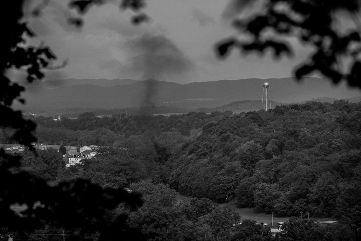 A cloud of smoke rises as the Radford Army Ammunition Plant in southwest Virginia conducts an open burn of munitions waste.