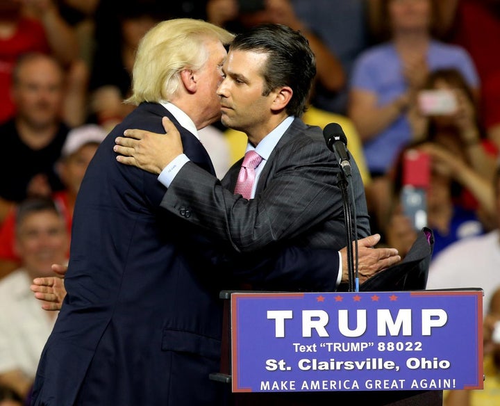 Then-candidate Donald Trump hugs his son Donald Trump Jr. at a campaign rally in 2016.