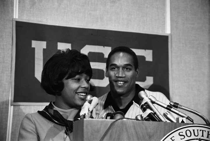 O.J. Simpson and his first wife, Marguerite, smile happily at a press conference after he was named winner of the 1968 Heisman Trophy.