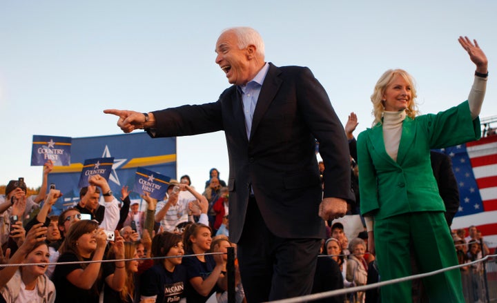 Republican presidential nominee John McCain, left, and his wife, Cindy, arrive at a campaign rally in Durango, Colorado, in October 2008.