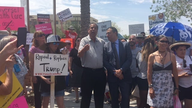 Jon “Bowzer” Bauman, Andy Slavitt, and the Indivisible Owls rally outside Senator Dean Heller’s office.
