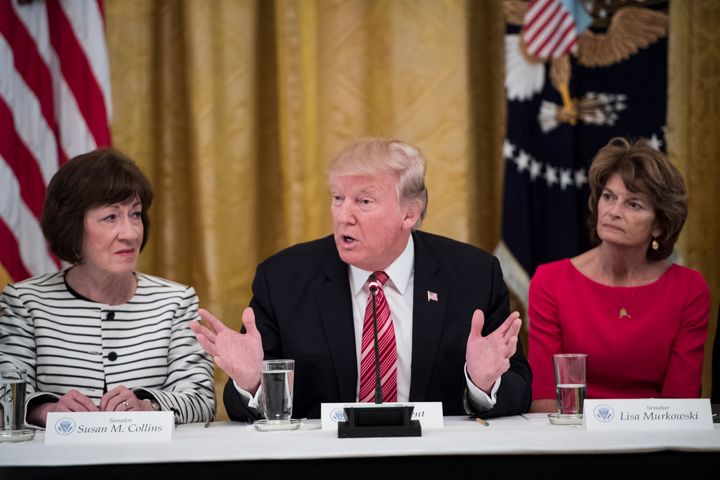President Donald Trump, center, speaks as he meets with Republican senators about health care in the White House on Tuesday, June 27, 2017. Seated with him are Sen. Susan Collins, R-Maine, and Sen. Lisa Murkowski, R-Alaska.