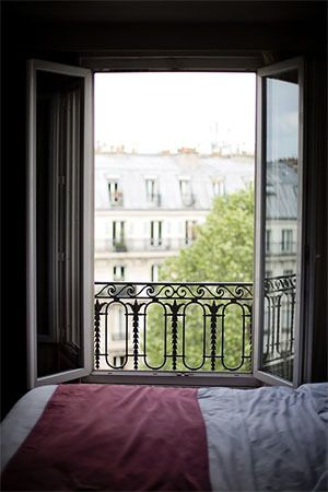 On hot summer days, large windows remain open in Paris instead of running an air conditioner
