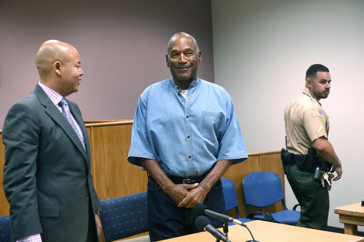 O.J. Simpson looks over at the Nevada Board of Parole Commissioners during his parole hearing on Thursday. 