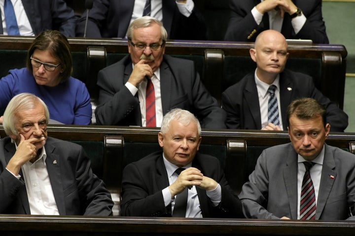 Leader of Law and Justice (PiS) party, Jaroslaw Kaczynski, center, attends a debate before a vote on the bill calling fo