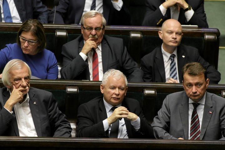 Leader of Law and Justice (PiS) party, Jaroslaw Kaczynski, center, attends a debate before a vote on the bill calling for an overhaul of the Supreme Court.