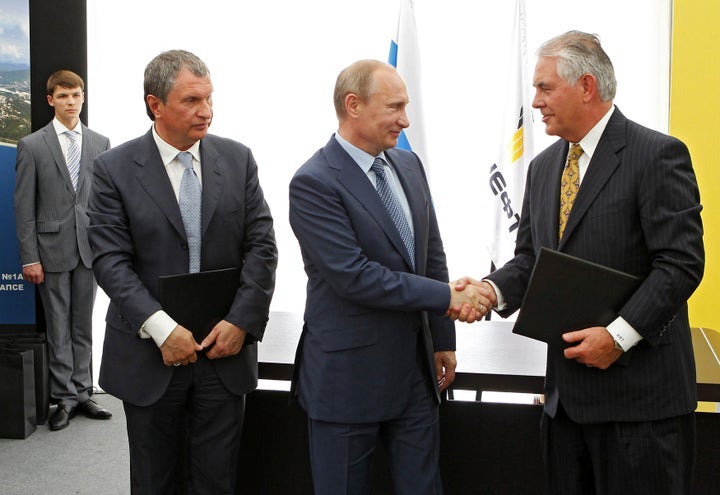 Russia's President Vladimir Putin, Rosneft Chief Executive Igor Sechin and Exxon Mobil Chief Executive Rex Tillerson take part in a signing ceremony at a Rosneft refinery in the Black Sea town of Tuapse, Russia on June 15, 2012. 