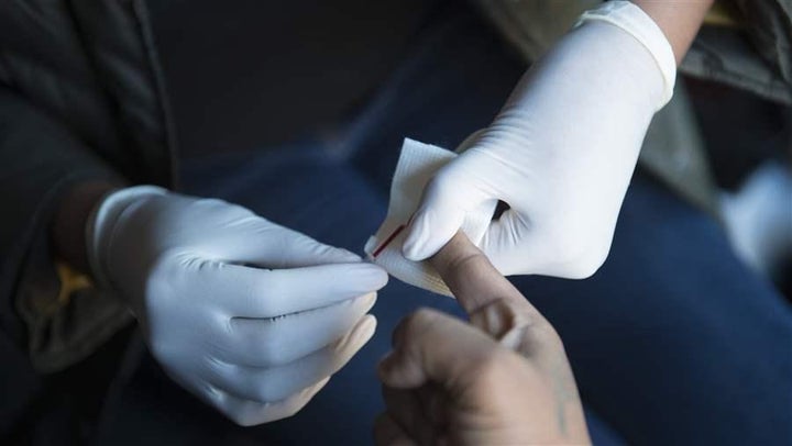 A woman in Washington, D.C., waits to have her blood drawn for an HIV test. The city once faced a public health crisis, but now leads the country in its efforts to combat HIV/AIDS.