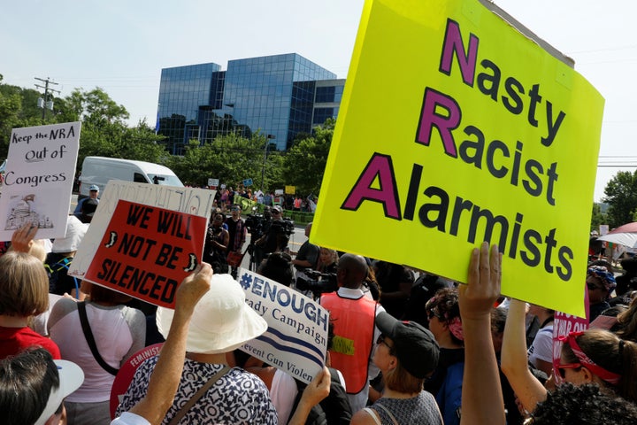 Protest leaders speak to protesters aligned with the Women's March as they begin a 17-mile march against gun violence from National Rifle Association (NRA) headquarters in Fairfax, Virginia, U.S. July 14, 2017. REUTERS/Jonathan Ernst