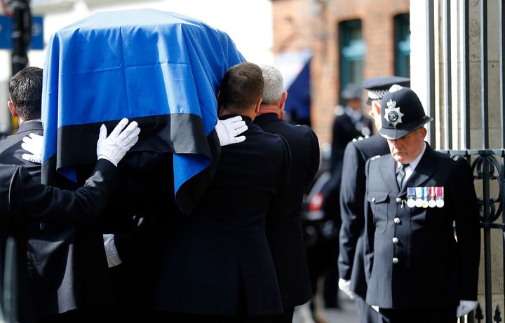 Pall bearers carry the coffin of PC Keith Palmer, the Met officer murdered in the Westminster attack, after his funeral at Southwark Cathedral