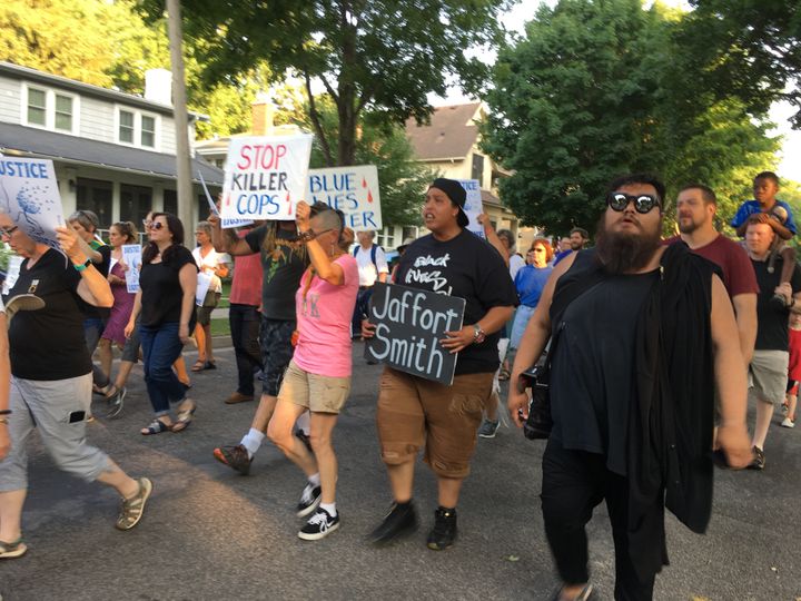 Black Lives Matter activist Chauntyll Allen (center) chants