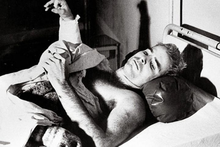 <p>John McCain lies in a hospital bed in Hanoi, North Vietnam, after being taken prisoner of war. (Francois Chalais) </p>