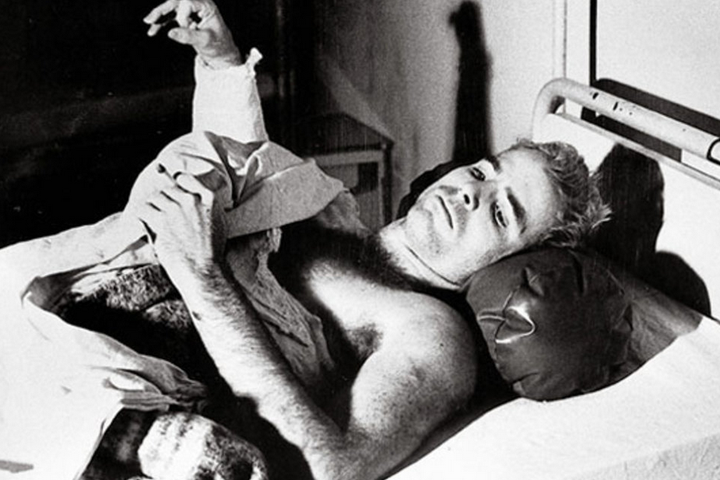 John McCain lies in a hospital bed in Hanoi, North Vietnam, after being taken prisoner of war. (Francois Chalais) 