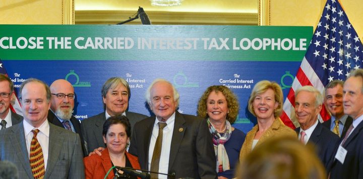 Members of Patriotic Millionaires, whose privileged members advocate for higher taxes on the rich, met with lawmakers in this 2015 photo to discuss legislation to close the carried interest loophole. (Senate Democrats, CC BY-SA)